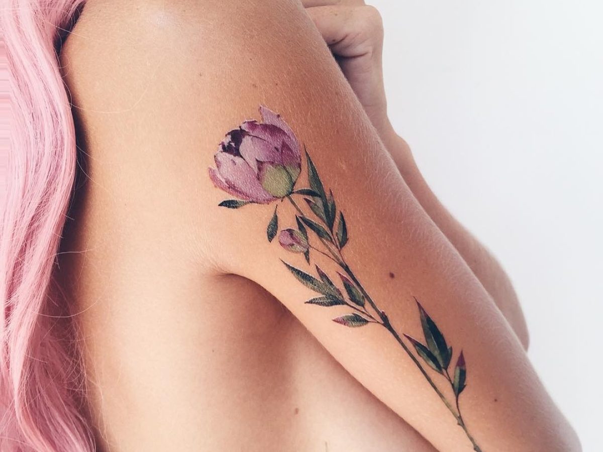 Lisianthus flower tattoo located on the bicep,