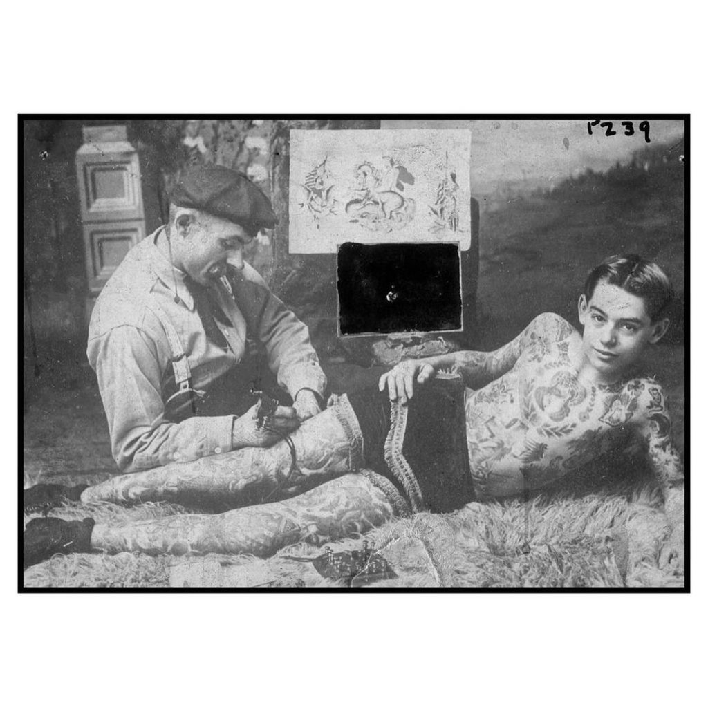Andy Stuertz getting tattooed by Charlie Wagner, 1908 vintage tattoo historical archive photograph