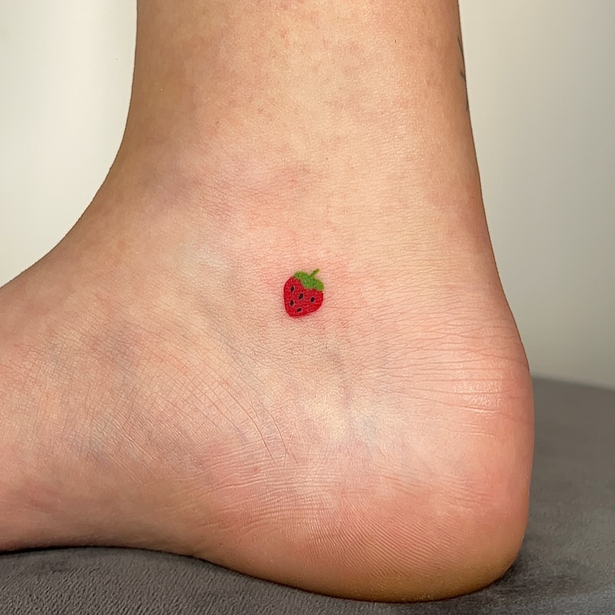 Tiny Delicate Strawberry Ankle Tattoo by Coco