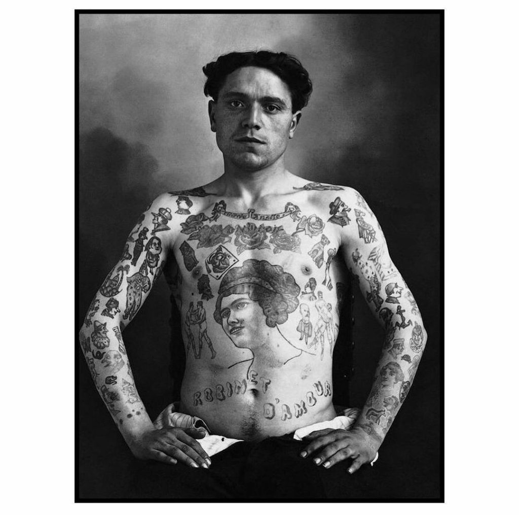 Tattooed French man, c.1950 vintage tattoo historical archive photograph