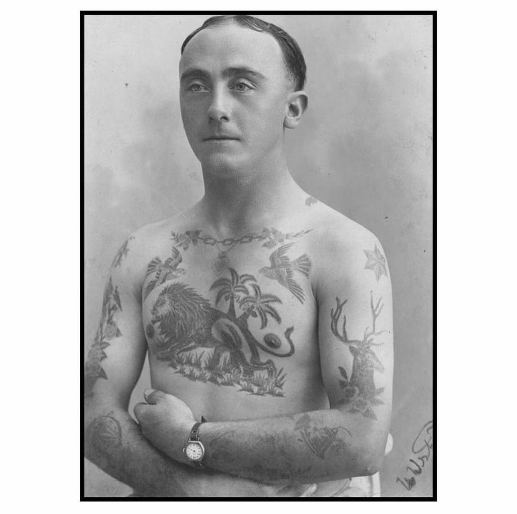 Tattooed man, c.1930 vintage tattoo historical archive photograph