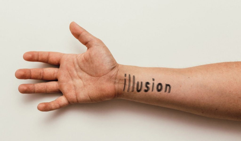 man arm displaying illusion lettering tattoo mockup