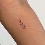 one word tattoo on girl's arm