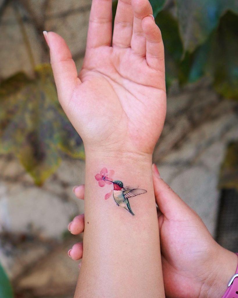 
Hummingbird and Flower Wrist Tattoo by Seulki Park