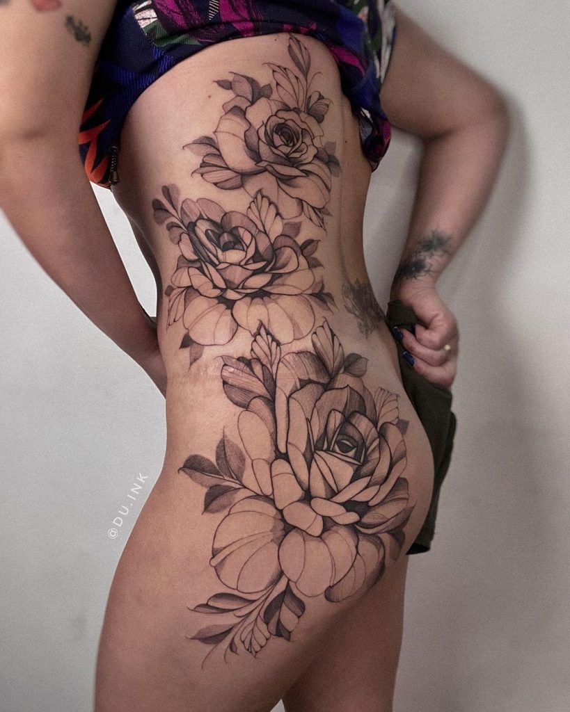 Black and Grey Dotwork Rose Lower Back Piece Tattoo by Eduardo Santos