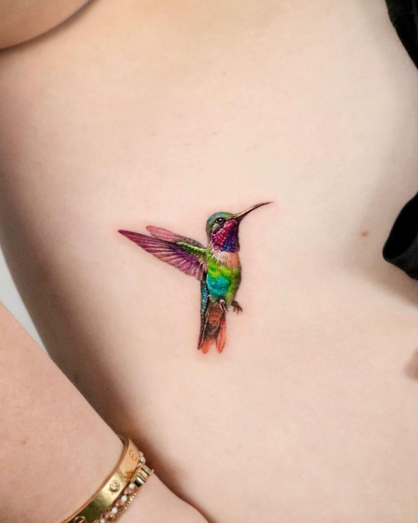 Small Colorful Hummingbird Tattoo by Mica Tattoos