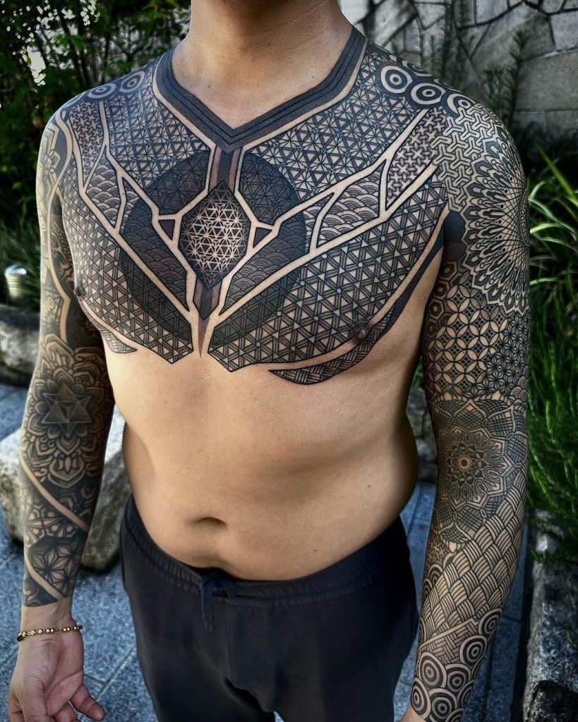 Abstract Geometric Chest And Arms Tattoo by Nissaco