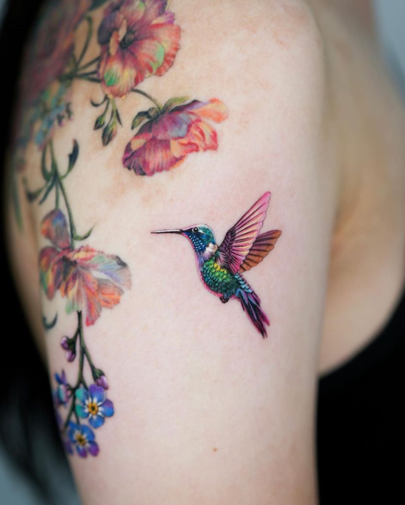 
Small Colorful Painterly Hummingbird Tattoo by Nonlee