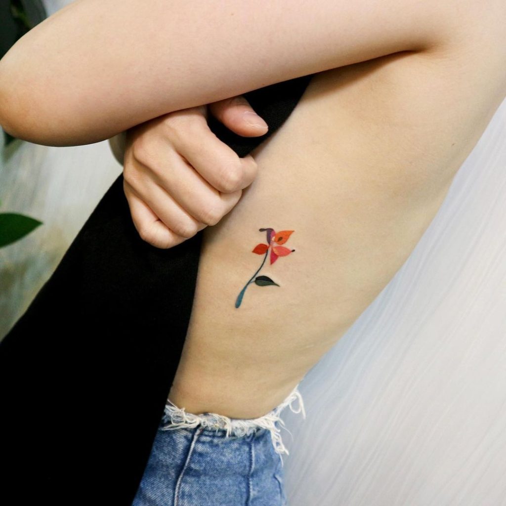 Minimalist Geometric Flower Rib Tattoo by POLYC