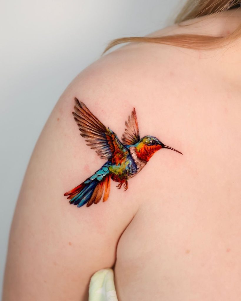 Realistic Colorful Painterly Hummingbird Tattoo by Rony