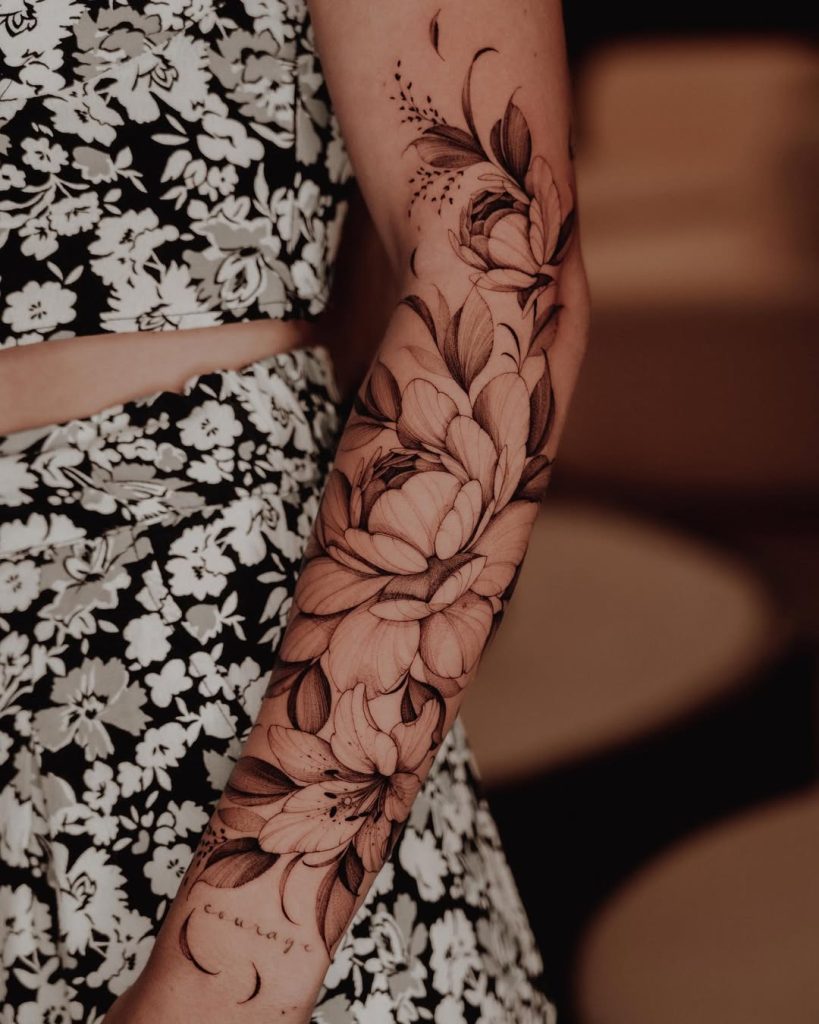 gorgeous floral sleeve tattoo for women in black & grey by Mateus de Assis