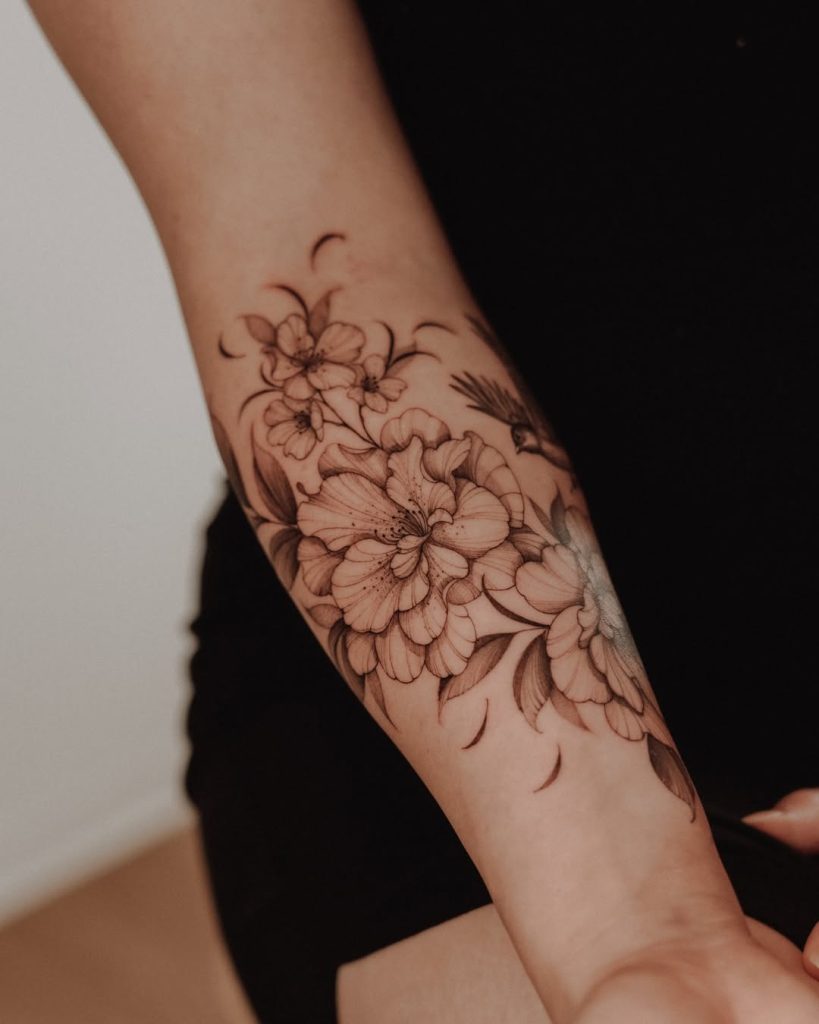 lovely petals of flower and bouquet tattoo on the arm in black & grey by Mateus de Assis