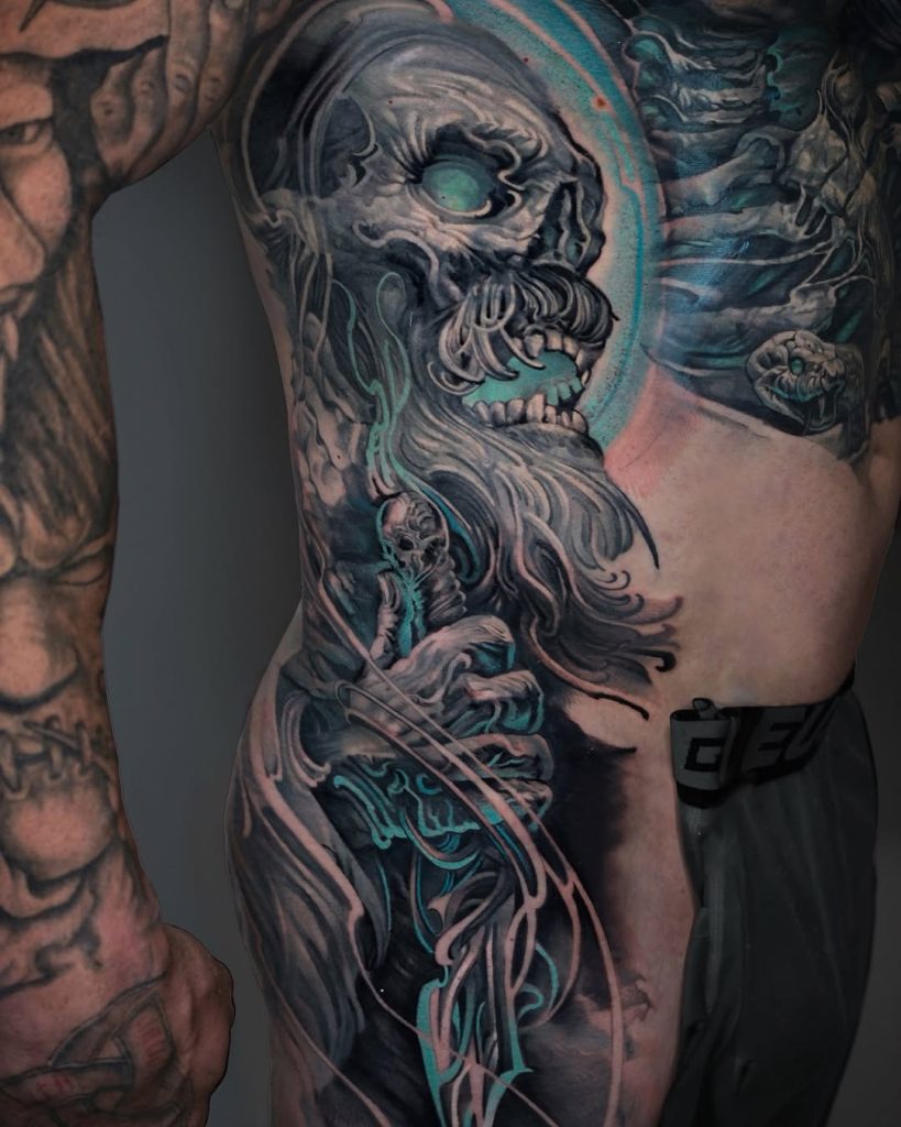 huge tattoo with shades of blue amazing black & blue work