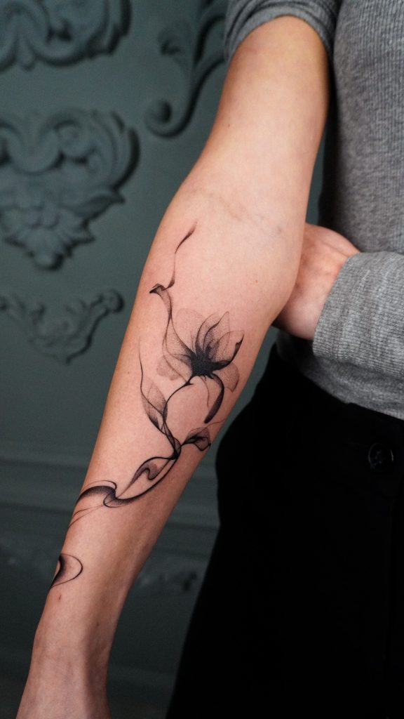 Vitalina's amazing fineline tattoo of flower in black & grey