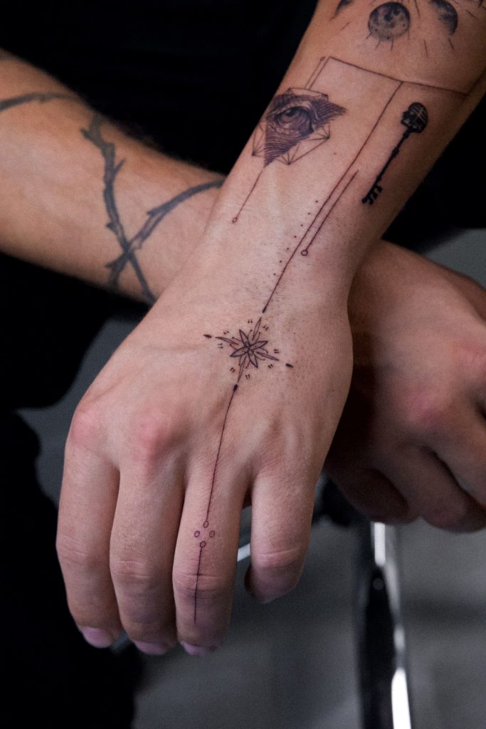 compass love and direction fineline tattoo