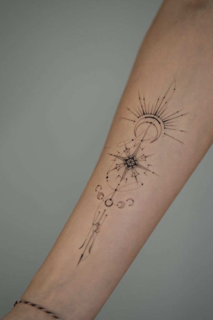tattoo artist Yana Laguta floral fineline dotwork in the forearm
