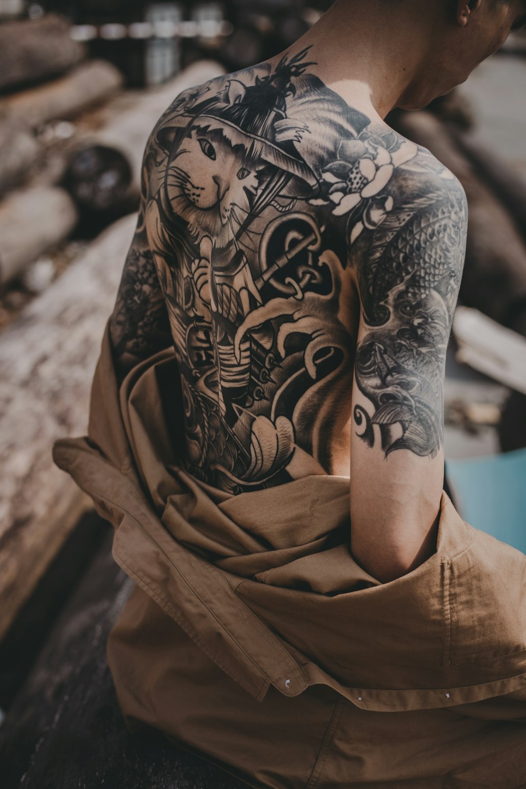 Person with a beautifully healed large back tattoo showing healthy ink after proper aftercare